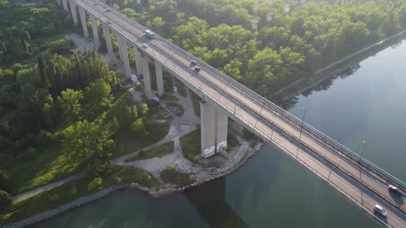 Aerial View of a Bridge Over a Large River with Heavy Traffic