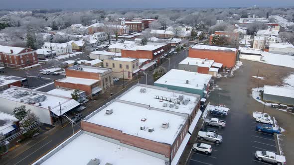 Drone shot of snowfall on small town USA