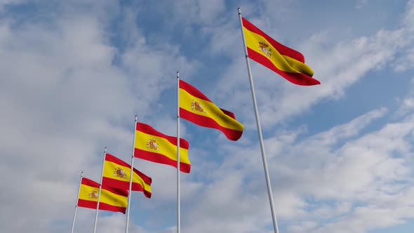 Waving Flags Of The spain blue sky