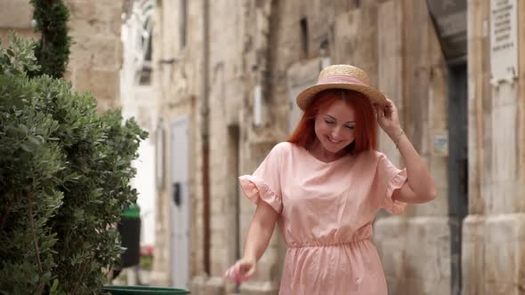 Happy Young Woman Tourist Walking Through Streets of Old European City Slow Motion