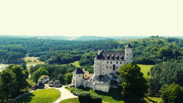 Bobolice medieval castle in a green land landscape aerial view. Poland