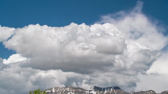 Timelapse of clouds brewing over mountain top