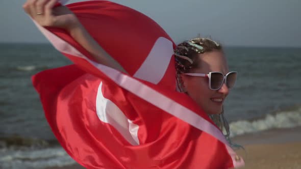 Beautiful Woman with the Flag of Turkey on the Sea Beach Slow Motion