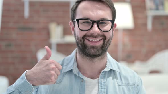 Portrait of Successful Beard Young Man Showing Thumbs Up