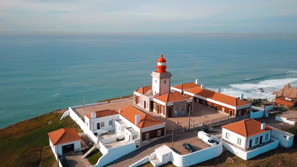 Scenic Aerial View Of Lighthouse At Cape Cabo Da Roca In Sunny Day