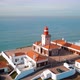 Scenic Aerial View Of Lighthouse At Cape Cabo Da Roca In Sunny Day - VideoHive Item for Sale
