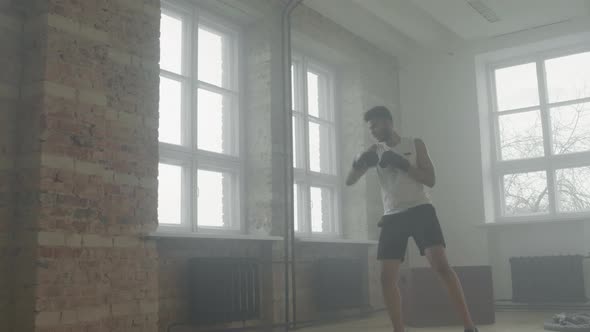 Sportsman Doing Boxing Punches At Workout