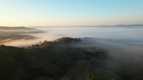 4K Drone Flying in the clouds. Flying through the clouds during sunrise