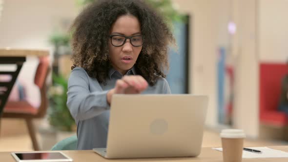 Young African Woman Closing Laptop and Going Away