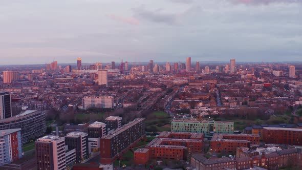 Aerial drone shot of London mile end looking towards stratford at sunset residential buildings