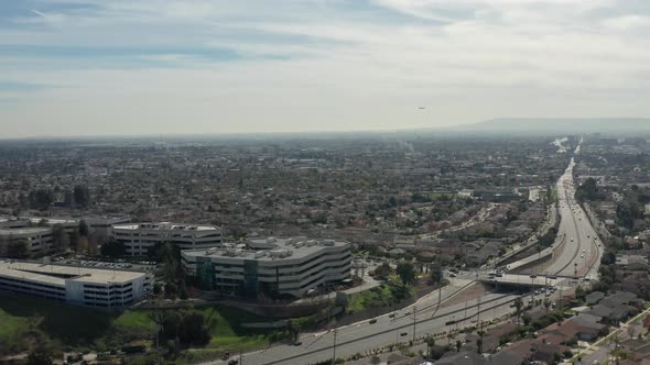 Aerial shot in Los Angeles near a highway in a slider motion from left to right