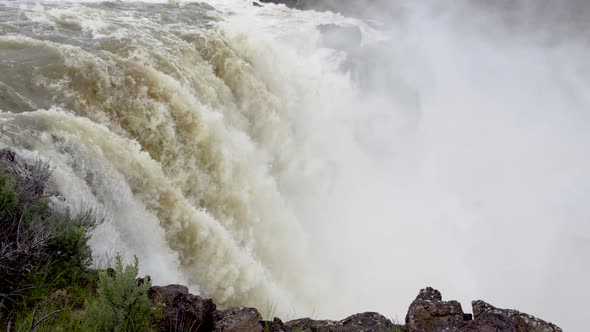 Huge waterfall flowing during Spring run off.