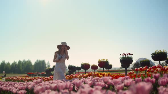 Beautiful Woman Laughing in Spring Flower Garden