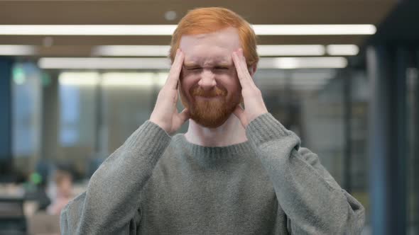 Portrait of Young Man Having Headache