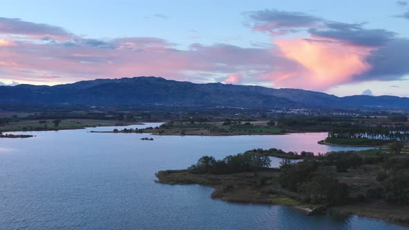 Lake drone aerial view of mountain panorama landscape at sunset in Marateca Dam in Castelo Branco, P