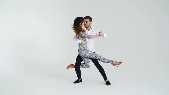 Concept of Love, Relationships and Social Dancing. Young Beautiful Couple Dancing Sensual Dance on a