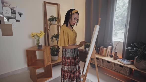 Woman Painting Picture at Home