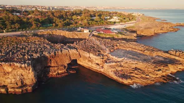 Aerial View of the Rocky Coast By the Sea in Cascais Town at Sunset Portugal