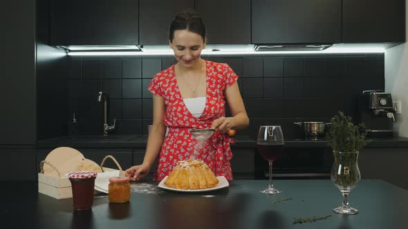 Woman cooked homemade pie in modern home kitchen. Food and lifestyle concept