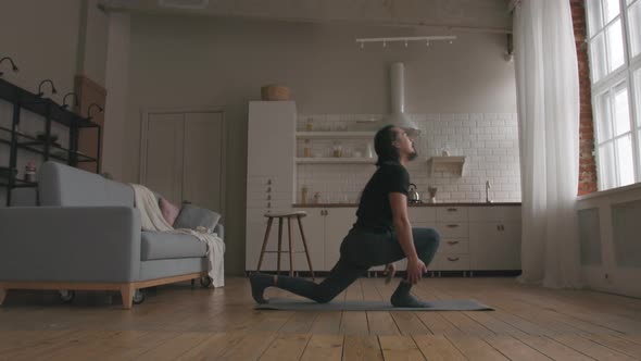 Man Practicing Yoga at home