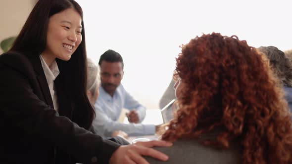 Multiracial Business People Working Together Inside Modern Bank Office  Focus on Asian Businesswoman