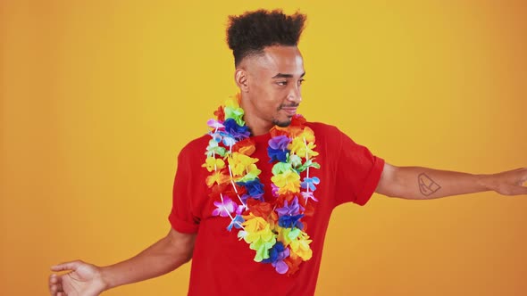 Funny African American Guy Dancing in Hawaiian Wreath Orange Background