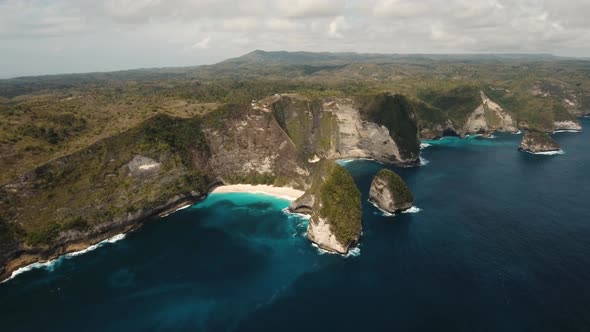 Rocky Cliff with Beach in the Sea. Karang Dawa.