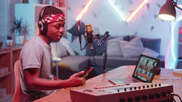 Afro-American Rapper Recording Music in Home Studio