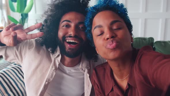 Young Multiethnic Arabian Man and African American Woman Make Funny Faces