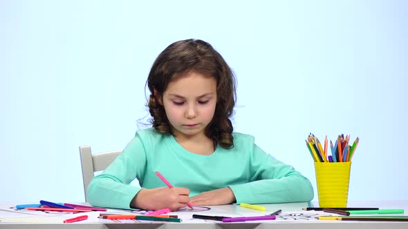 Children Paint a Picture with Pencils and Admire Their Work. Close Up. White Background