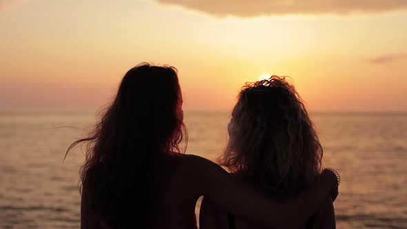 Silhouette Close Up Women Friends Hugging on Beach at Sunset Attractive Together of Female Traveler