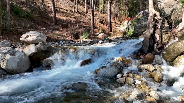 Waterfall on a mountain river aerial view