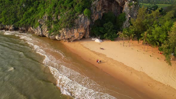 4K Aerial view top view of drone, sea waves and beautiful sand beach.