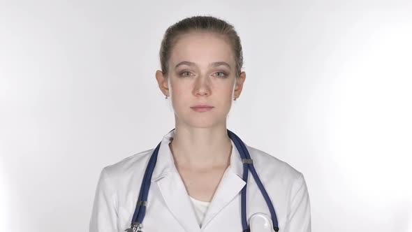 Young Lady Doctor Looking at Camera White Background