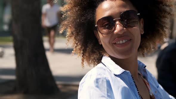 Adorable Ethnic Woman in Sunglasses 