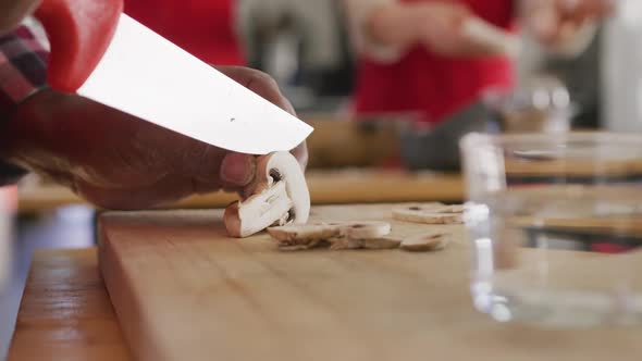 Chef cutting mushrooms