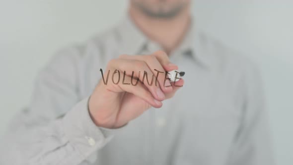 Volunteer Writing on Screen with Hand