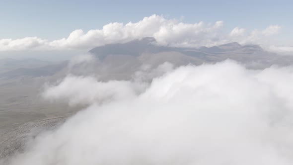 Scenic aerial view of moving white clouds at Abuli Mountain. Georgia