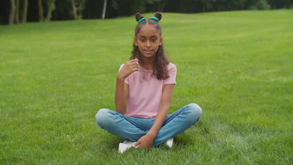 Preteen Blogger Girl Filming Video for Vlog in Park