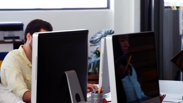 Business executives working at desk