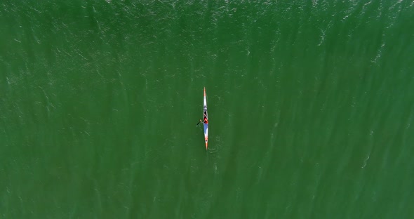 Birds eye view of a person kayaking at Lagoon Beach in Cape Town South Africa