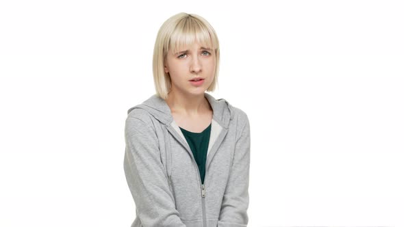 Closeup Female Portrait of Nervous Young Woman in Casual Clothes Isolated Standing in Front of
