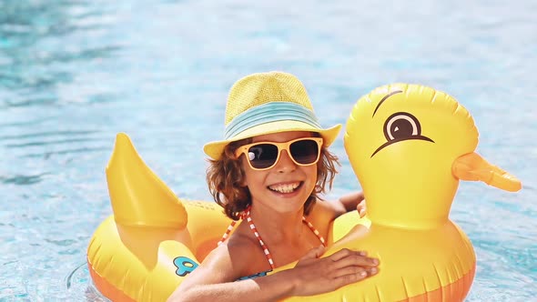 Happy Child Having Fun on Summer Vacation. Funny Kid in Swimming Pool