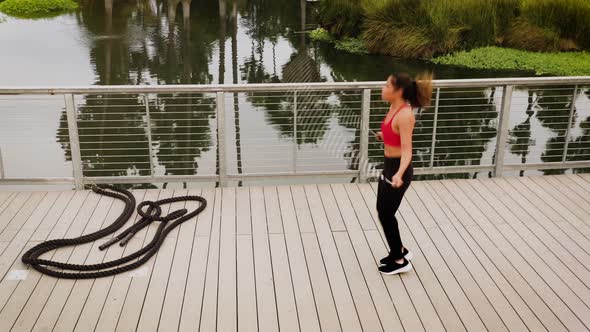 Aerial shot of a woman working out in the park