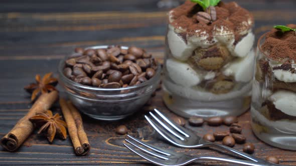 Two Portions Classic Tiramisu Dessert in a Glass on Wooden Background