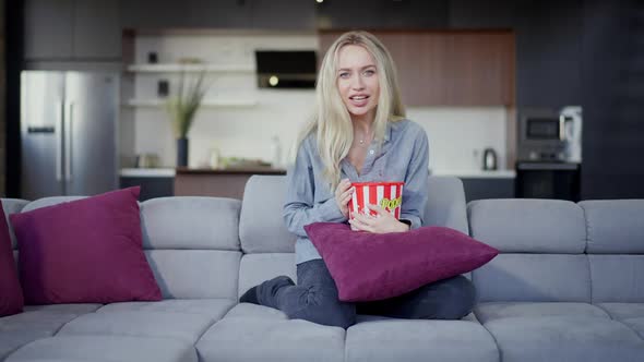 Wide Shot of Cheerful Laughing Slim Beautiful Caucasian Woman Holding Popcorn Bucket Watching Comedy