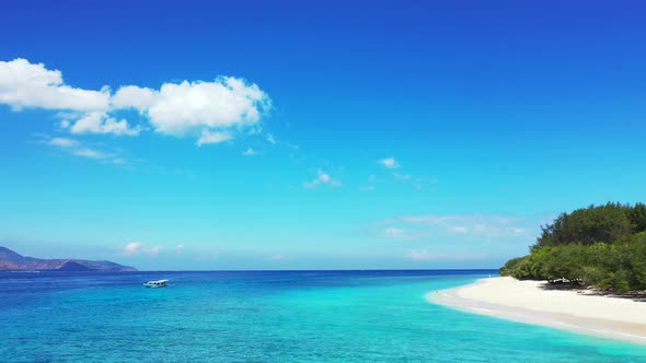 Beautiful fly over tourism shot of a summer white paradise sand beach and aqua blue ocean background