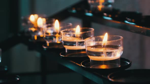 Burning Candles Inside Church Interior Prayer Candles Lit in Row Spirituality