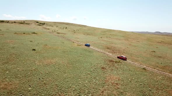 Aerial view. Cars go across the field. General's beaches, Crimea