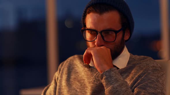 Thoughtful business executive sitting in office